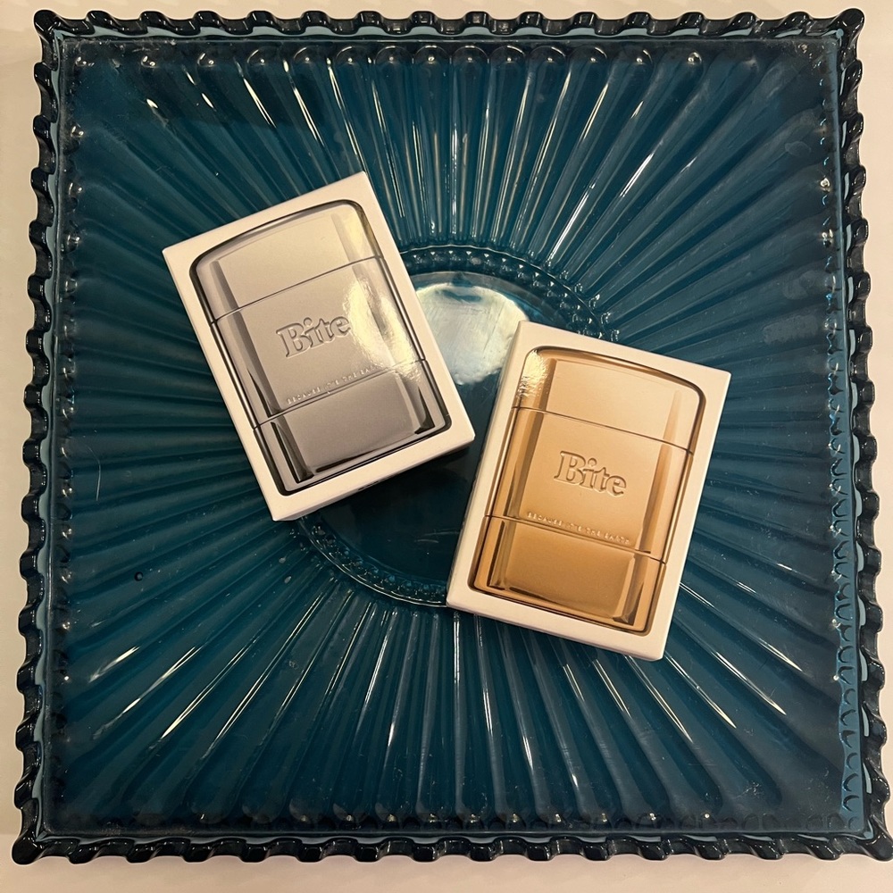 Refillable Bite Deodorant Silver Finish Case AND Bite Body Balm Gold Finish Case